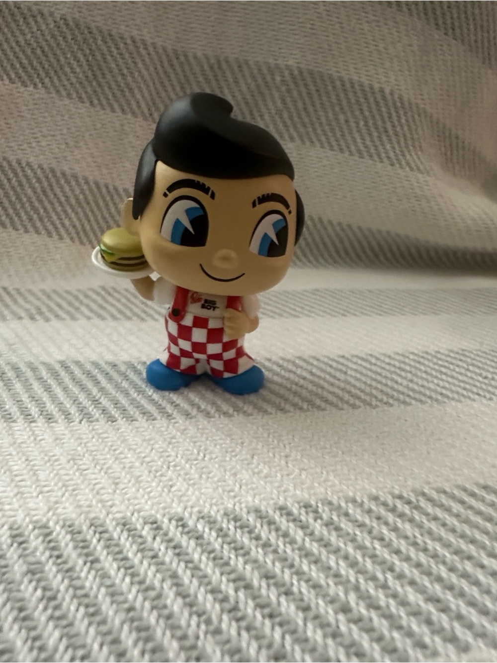 Blue-Eyed Retro Server Figurine Toy with Red Checkered Outfit
